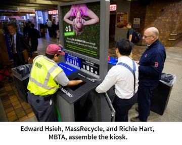 Edward Hsieh, MassRecycle, and Richie Hart, MBTA, assemble the kiosk